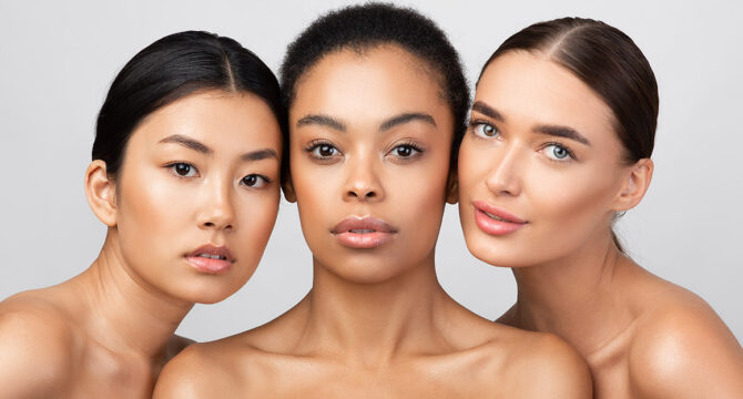 Three Pretty Girls Posing Shirtless On Gray Studio Background